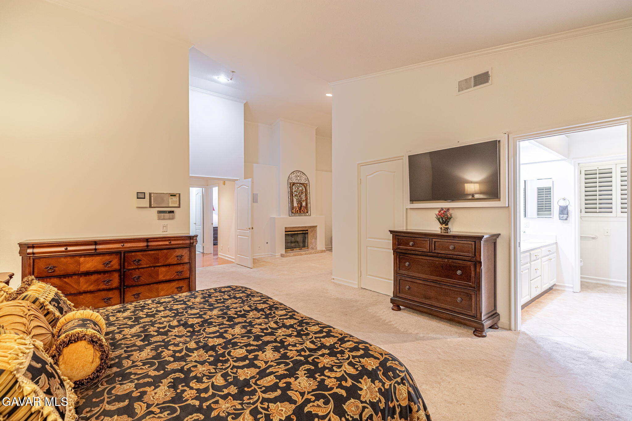 19809 Winged Foot Way Porter Ranch, CA 91326 - Photo 31 of 70 a bedroom with furniture and a flat screen tv