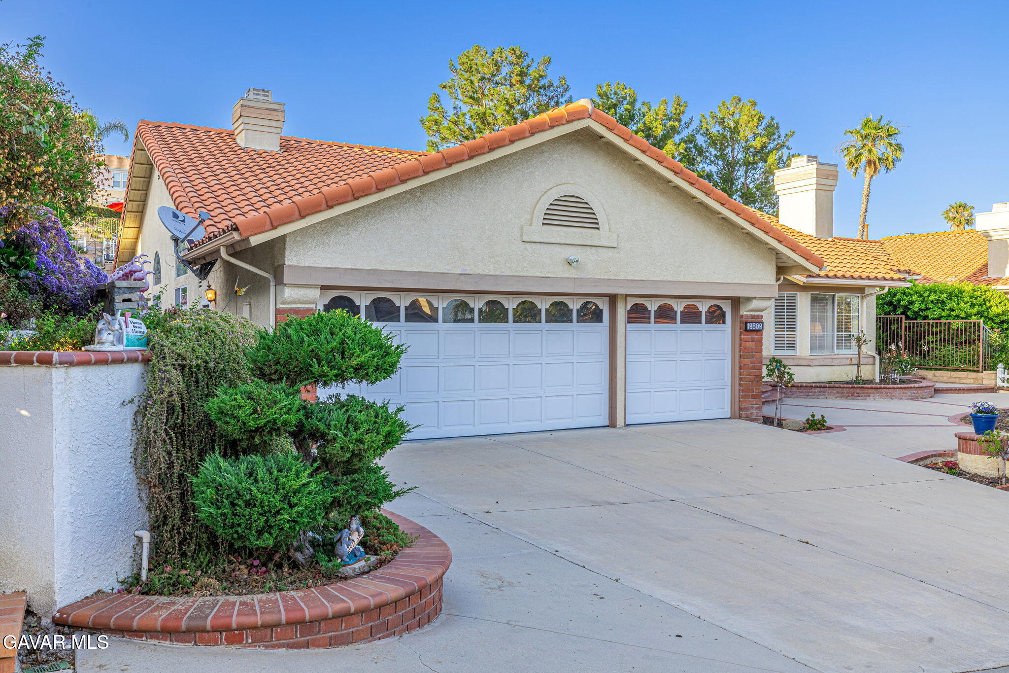 19809 Winged Foot Way Porter Ranch, CA 91326 - Photo 8 of 70 a view of a house with a yard and potted plants