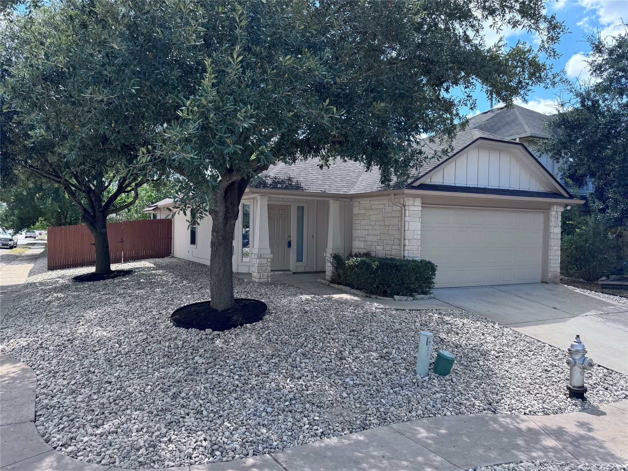 3411 Wickham Lane Austin, TX 78725 - Photo 1 of 20 Single story 3 bedroom, 2 full bath home featuring an attached garage, stone siding with nice size back yard on corner lot.