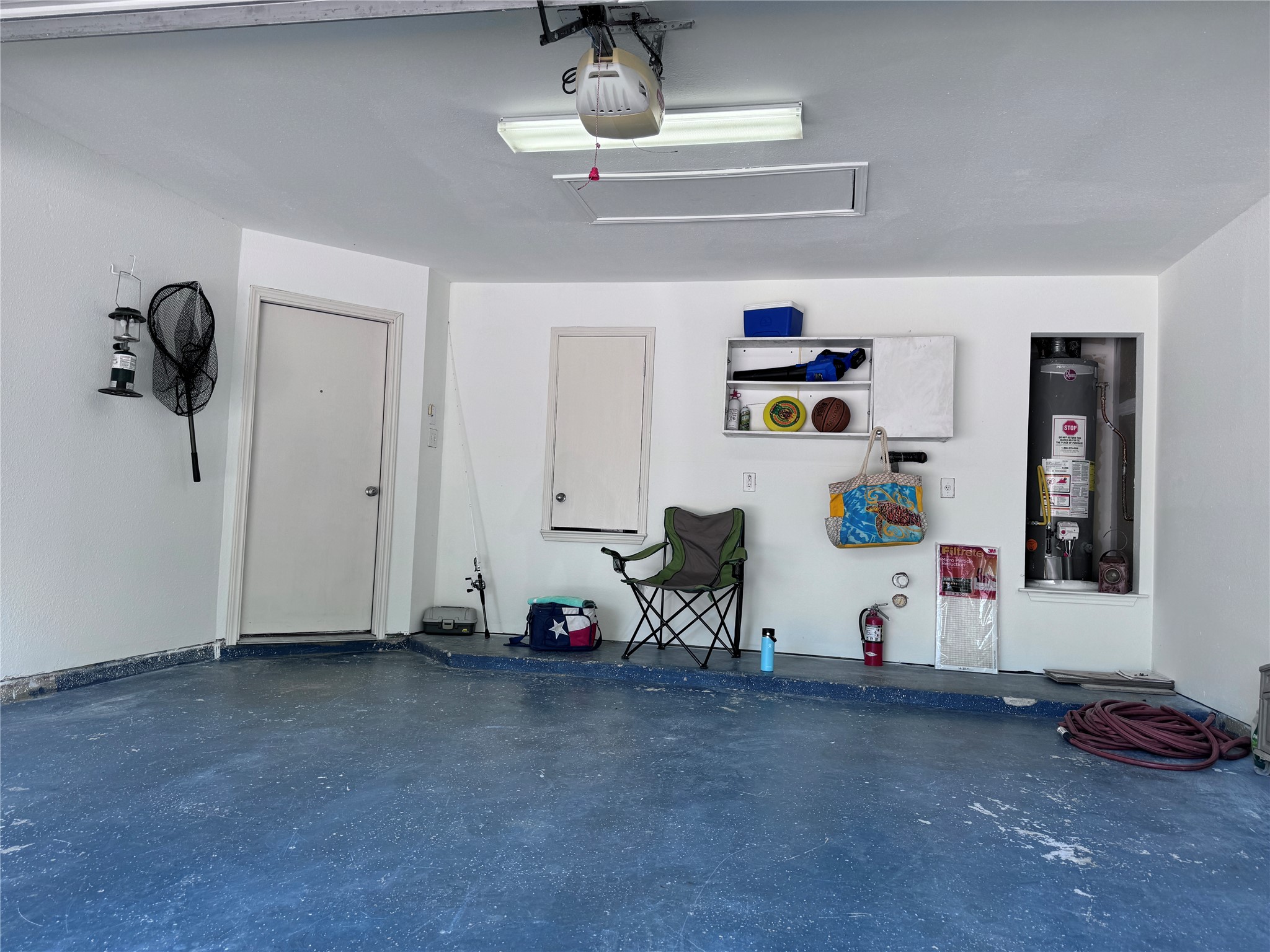 3411 Wickham Lane Austin, TX 78725 - Photo 17 of 20 Spacious 2 car garage with a garage door opener