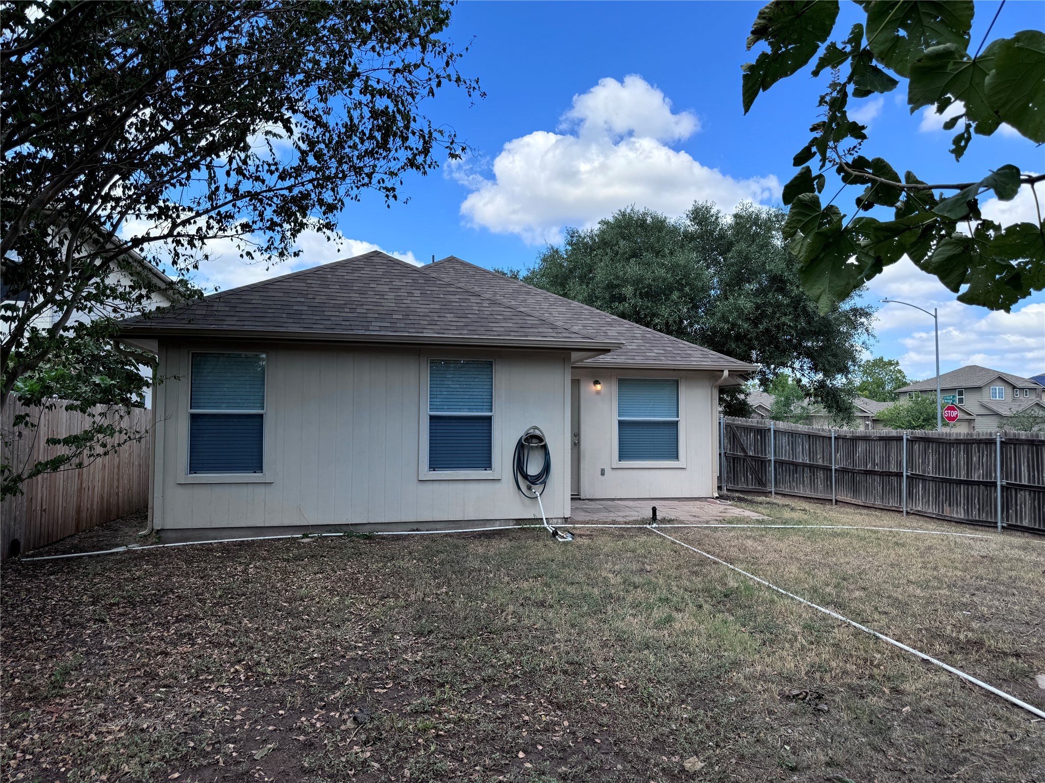 3411 Wickham Lane Austin, TX 78725 - Photo 20 of 20 Rear view of fenced backyard.