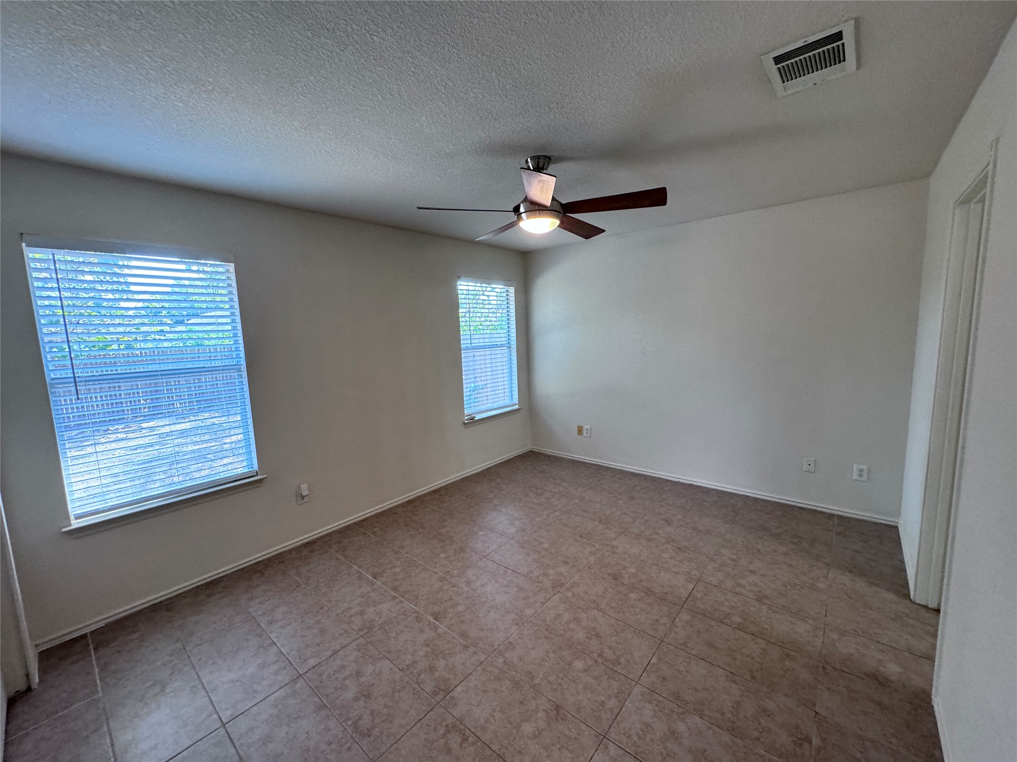 3411 Wickham Lane Austin, TX 78725 - Photo 9 of 20 Primary Bedroom with a ceiling fan