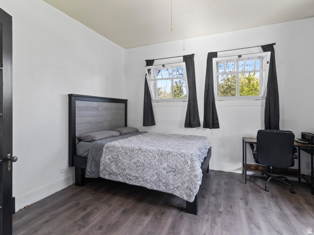 158 East 300 South Logan, UT 84321 - Photo 6 of 25 Bedroom featuring wood finished floors and an office area