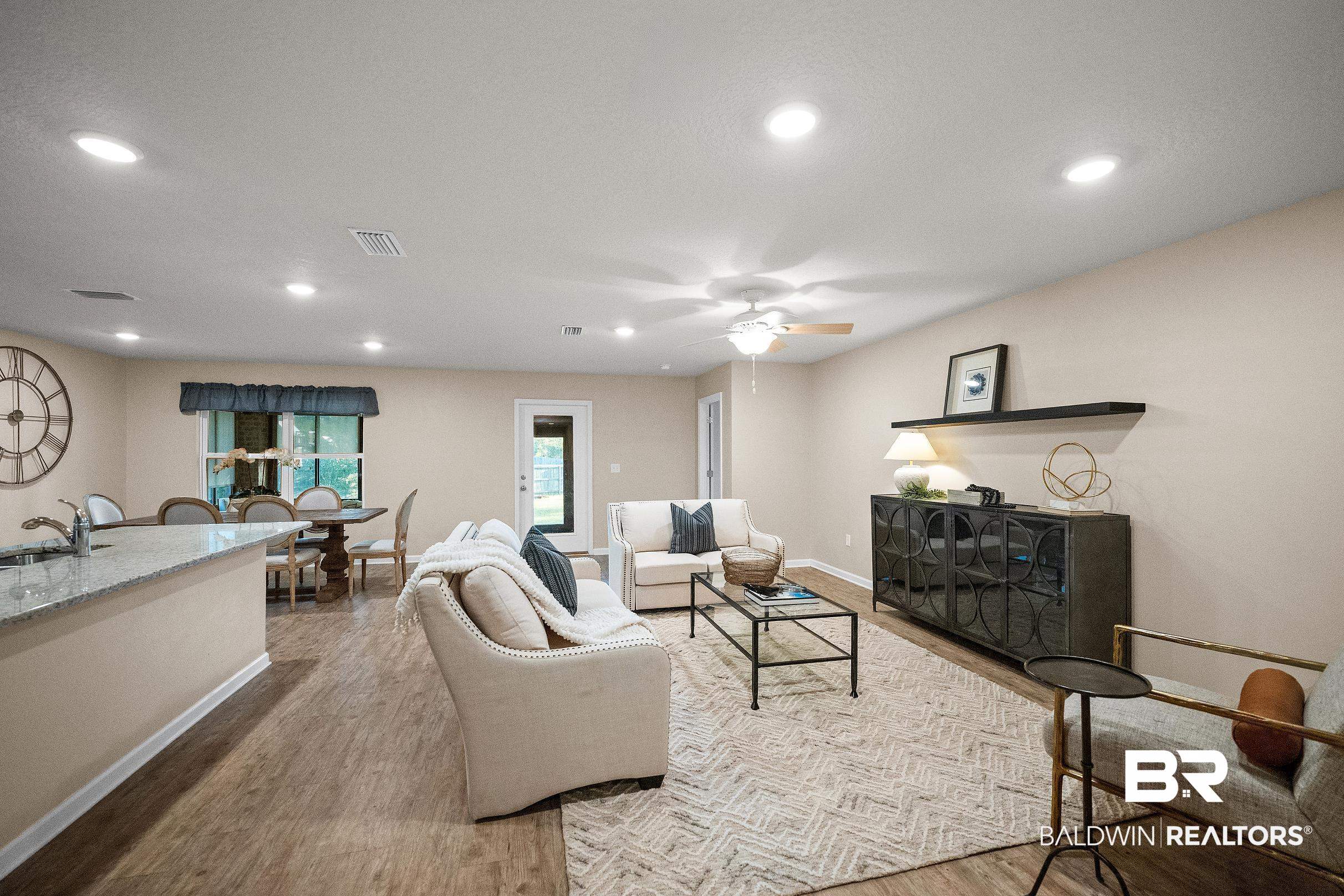 8294 Irwin Loop Daphne, AL 36526 - Photo 6 of 29 Open-concept living space featuring recessed lighting and wood-finish flooring