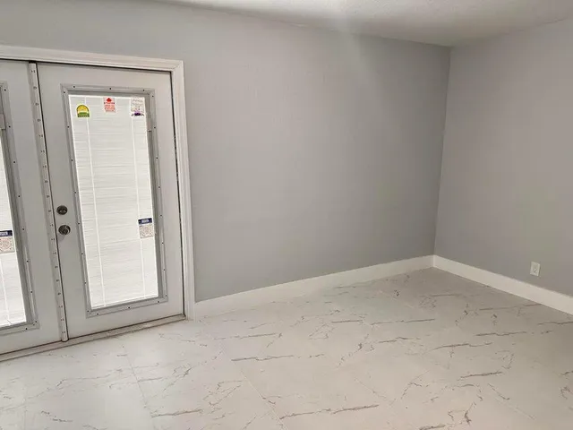 a view of an empty room and window