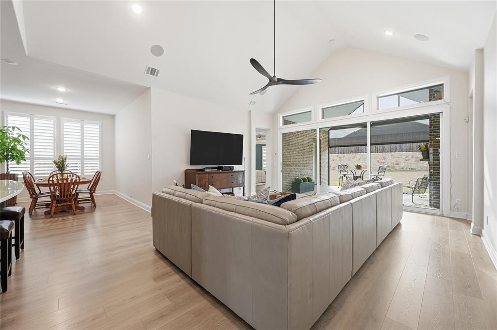 4409 Lk Vw Road Oak Point, TX 75068 - Photo 11 of 40 a living room with furniture a flat screen tv and a large window