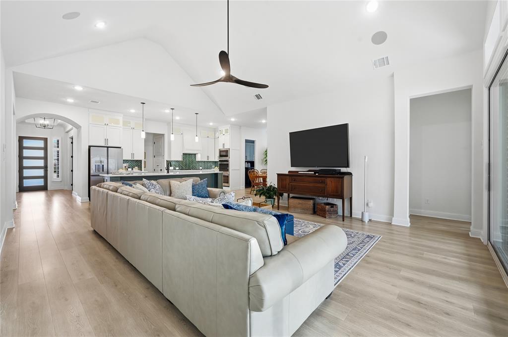 4409 Lk Vw Road Oak Point, TX 75068 - Photo 12 of 40 a living room with furniture and a flat screen tv