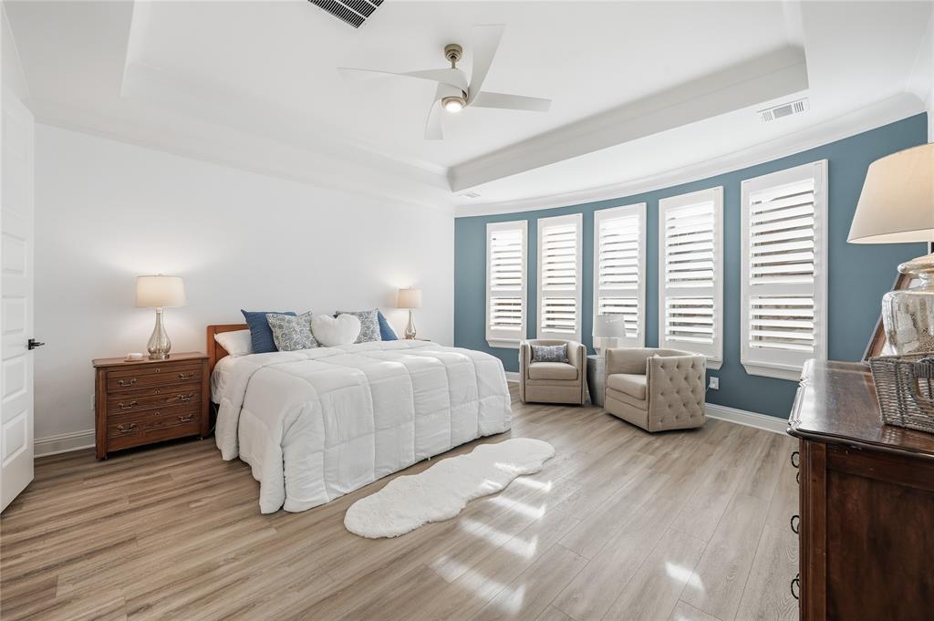 4409 Lk Vw Road Oak Point, TX 75068 - Photo 13 of 40 a bedroom with a bed and wooden floor