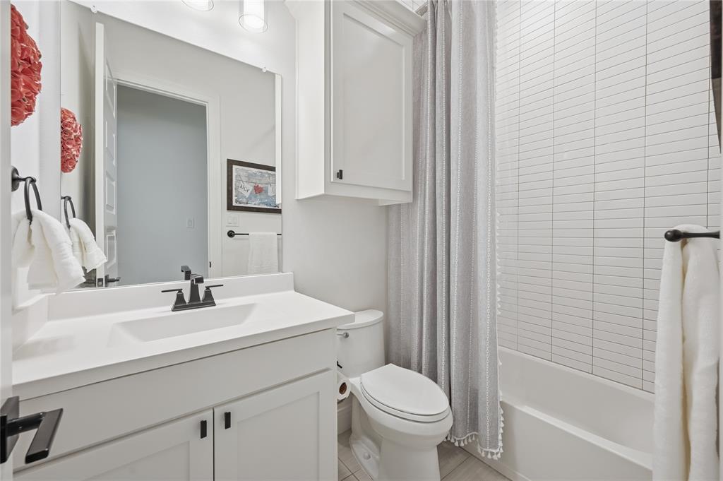 4409 Lk Vw Road Oak Point, TX 75068 - Photo 20 of 40 a bathroom with a sink toilet and shower