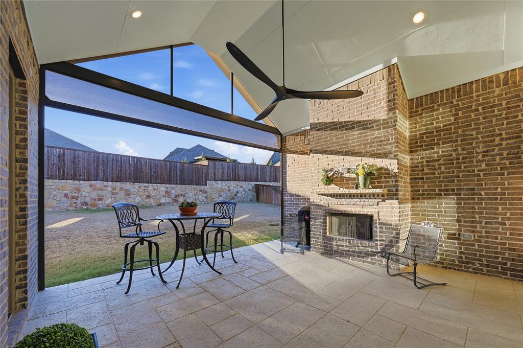 4409 Lk Vw Road Oak Point, TX 75068 - Photo 25 of 40 a patio with a fireplace and chairs