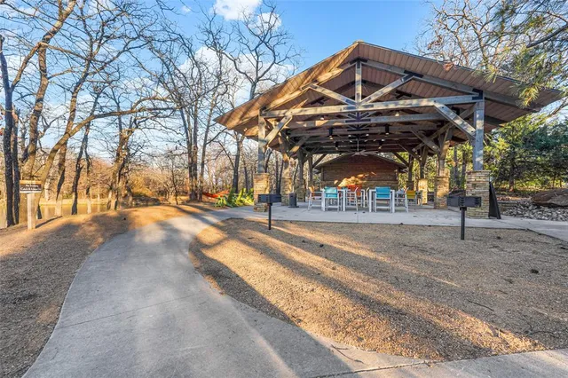 a view of a backyard with sitting area