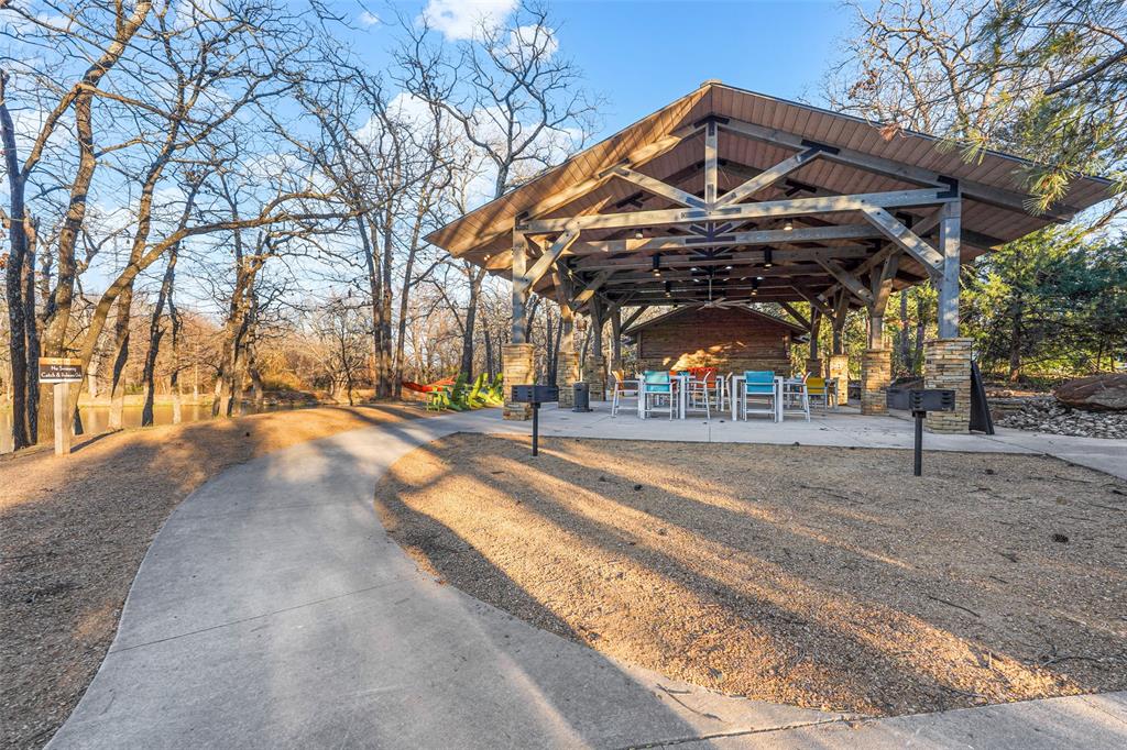 4409 Lk Vw Road Oak Point, TX 75068 - Photo 34 of 40 a view of a building with a trees
