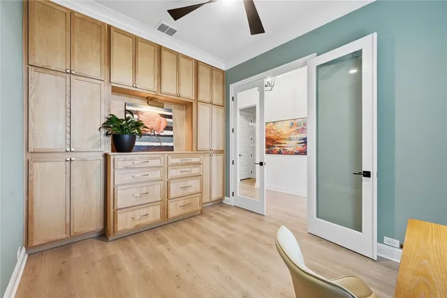 a view of a bedroom with cabinet cabinet and windows