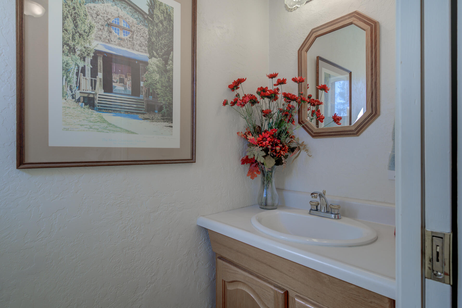 8614 Redbank Road Redding, CA 96001 - Photo 13 of 31 a bathroom with a sink mirror and vanity