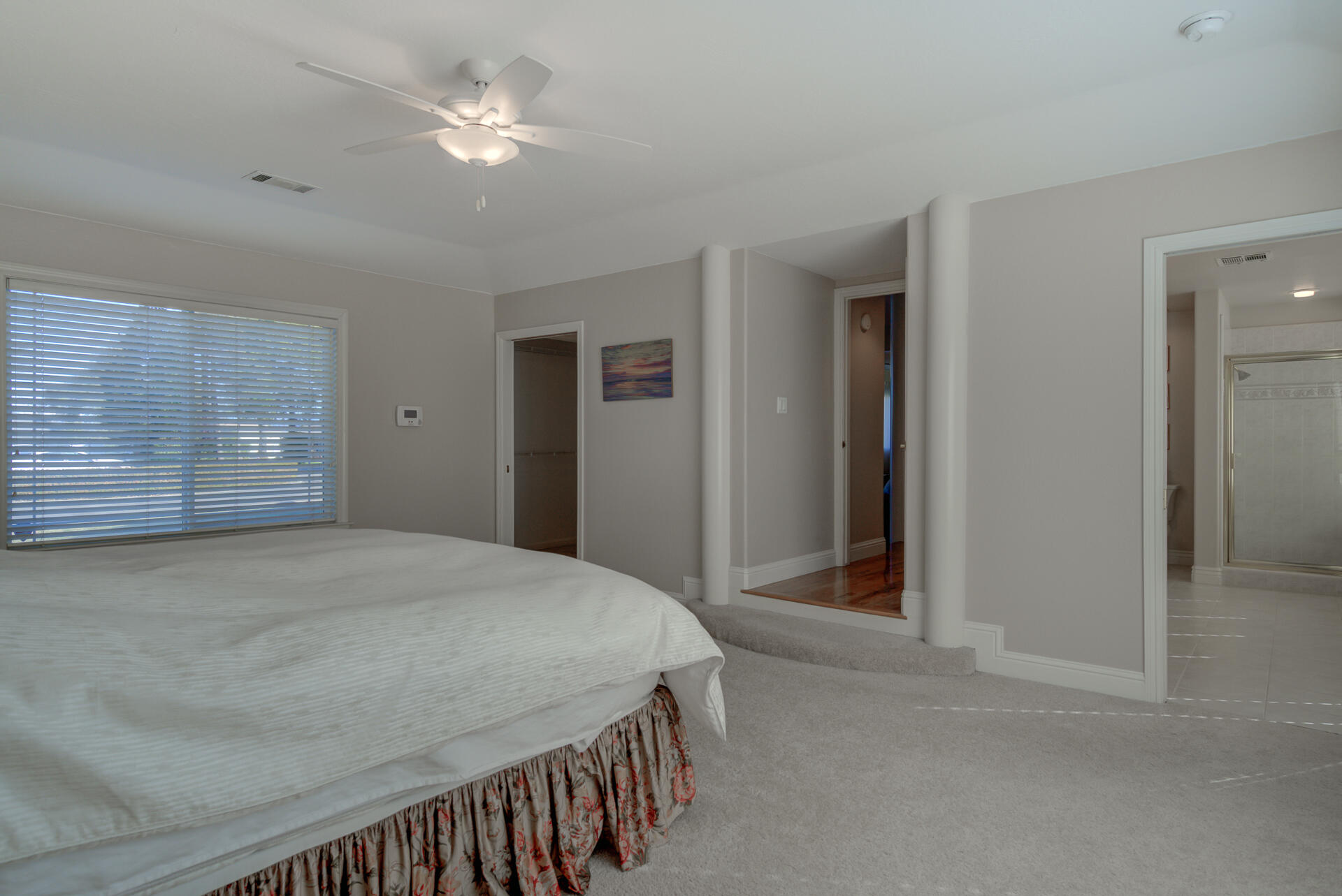 8614 Redbank Road Redding, CA 96001 - Photo 20 of 31 a bedroom with a bed and ceiling fan