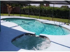 348 Ne Port Palm Bay, FL 32905 - Photo 3 of 7 a view of a backyard with swimming pool