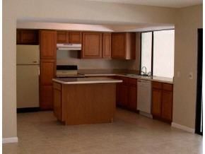 348 Ne Port Palm Bay, FL 32905 - Photo 7 of 7 a kitchen with a sink and a refrigerator