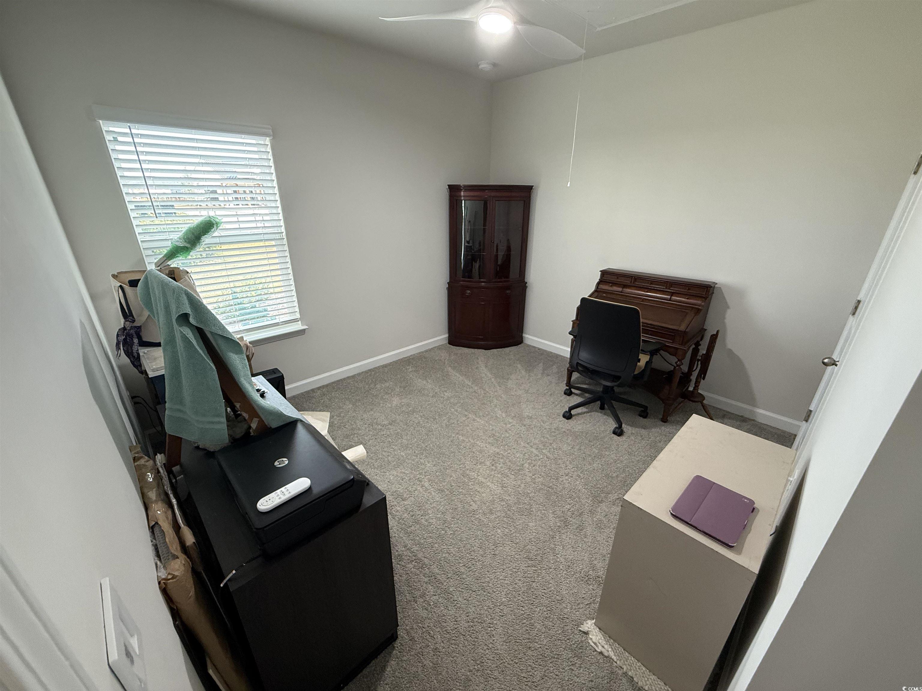 435 Rollins Drive Longs, SC 29568 - Photo 14 of 23 Office area featuring light colored carpet and ceiling fan