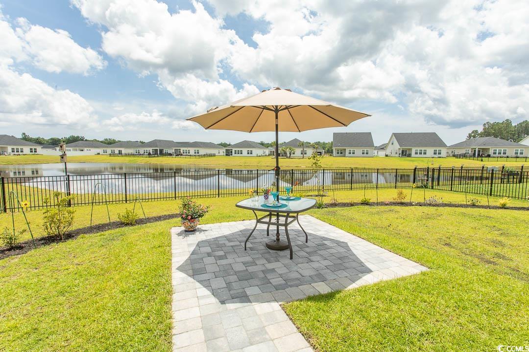 435 Rollins Drive Longs, SC 29568 - Photo 16 of 23 Fenced backyard with a residential view, a patio area, and a water view