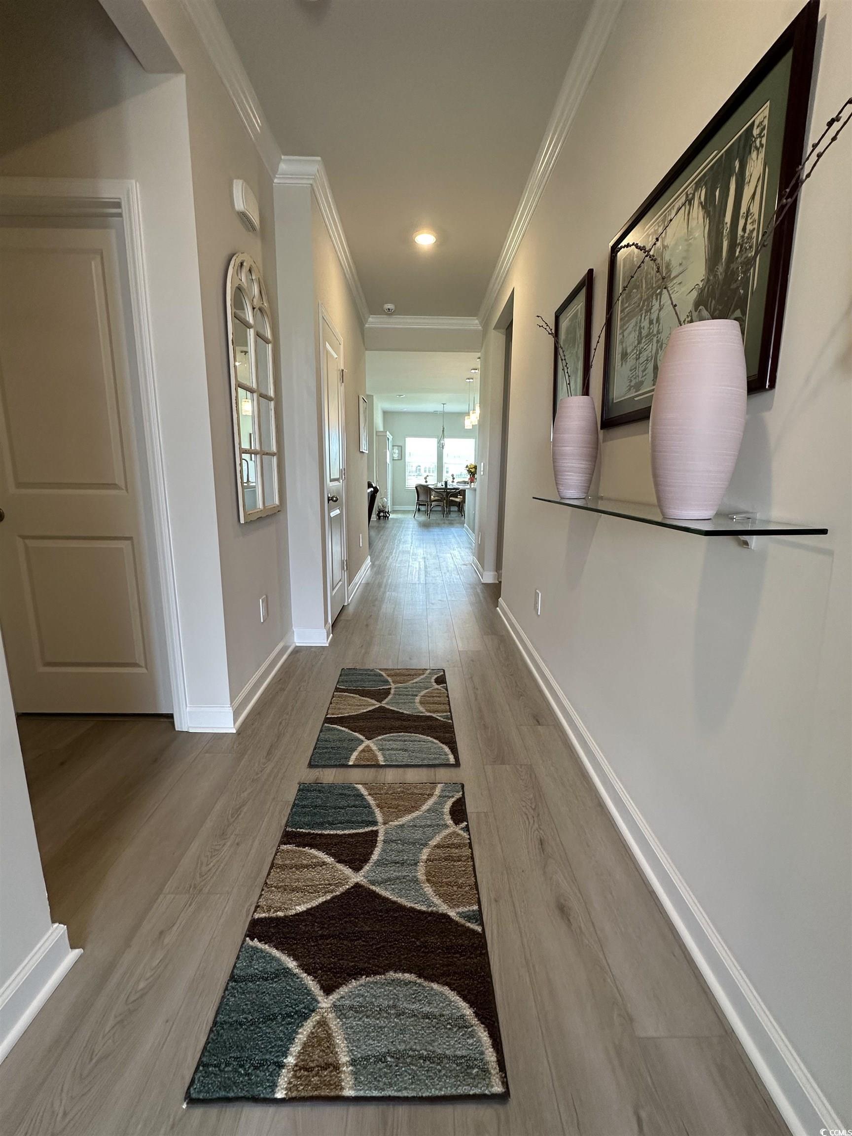 435 Rollins Drive Longs, SC 29568 - Photo 2 of 23 Corridor featuring light wood finished floors, crown molding, and recessed lighting