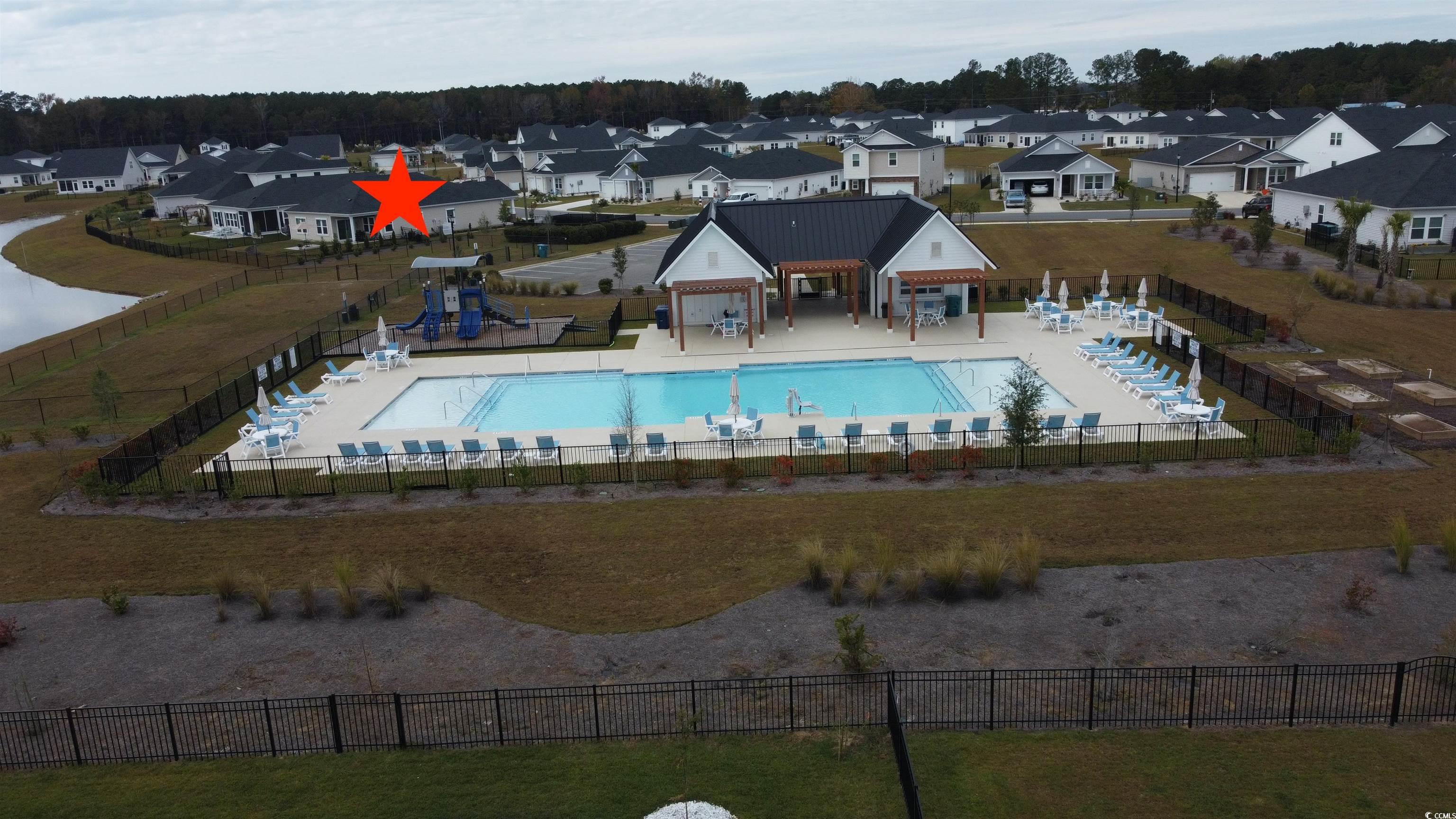 435 Rollins Drive Longs, SC 29568 - Photo 21 of 24 Community pool with a patio area and a residential view
