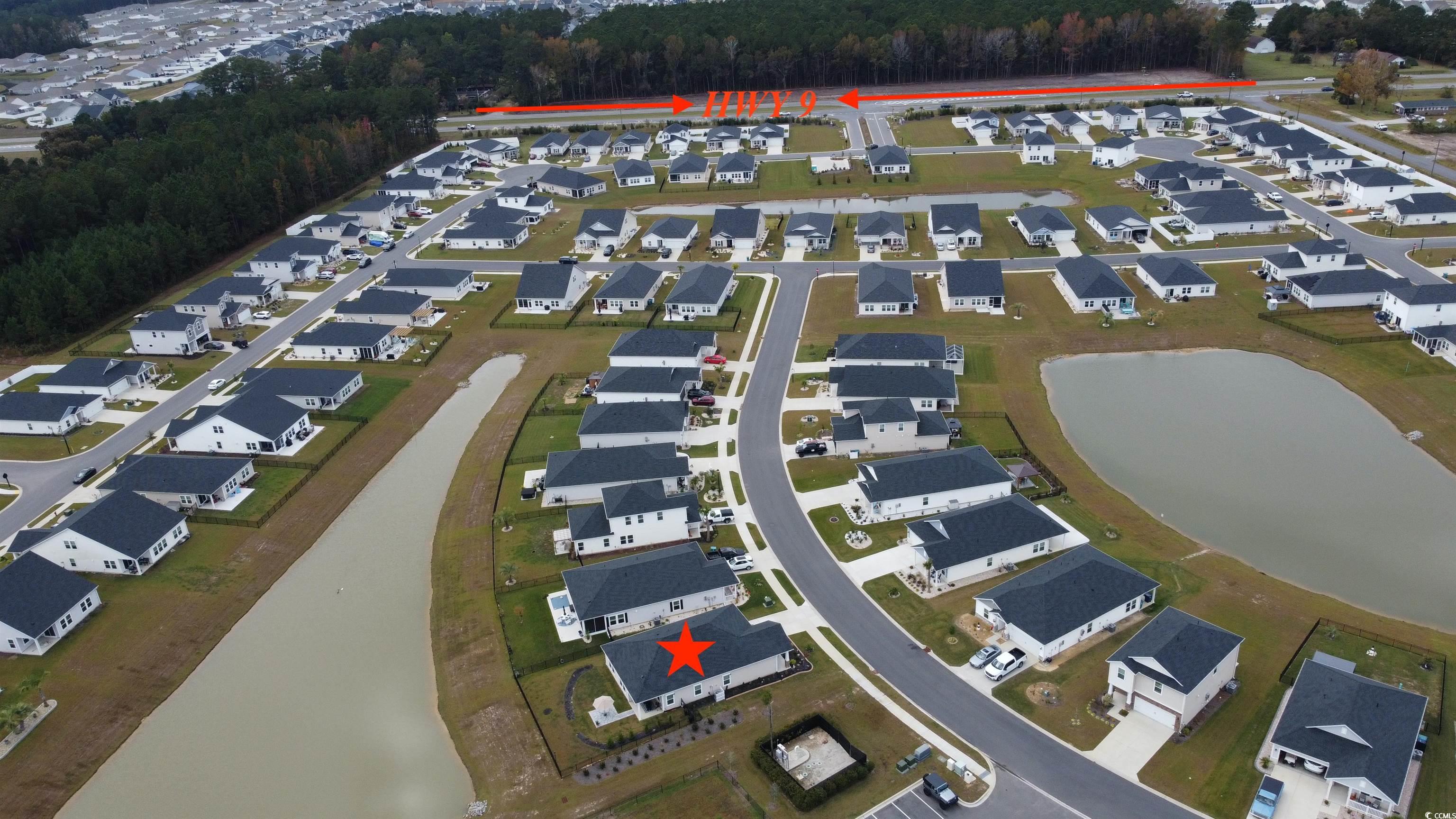 435 Rollins Drive Longs, SC 29568 - Photo 24 of 24 Aerial view of property and surrounding area featuring nearby suburban area and a nearby body of water