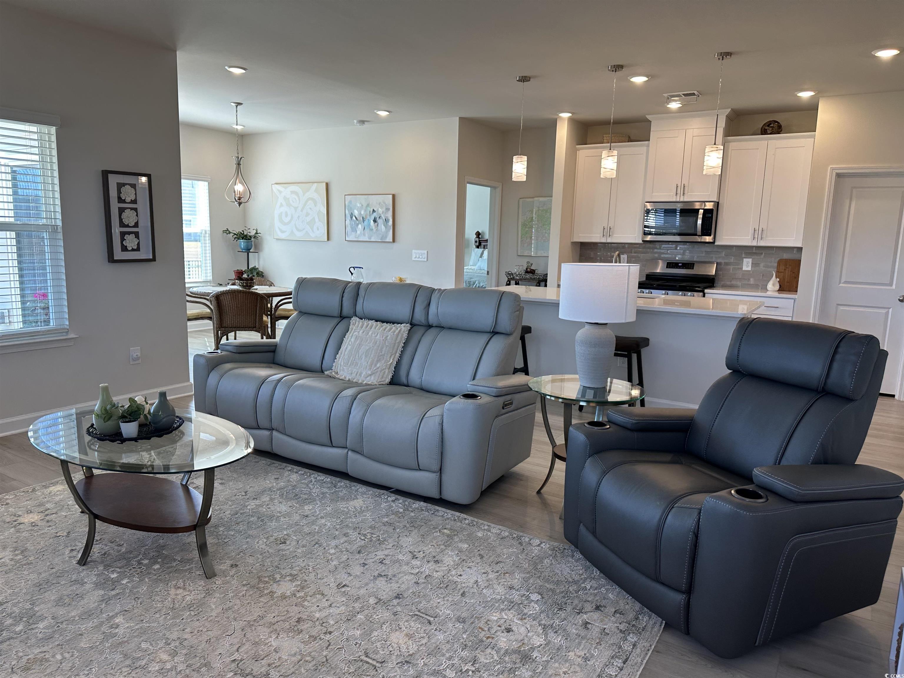 435 Rollins Drive Longs, SC 29568 - Photo 3 of 23 Living room featuring wood finished floors and recessed lighting