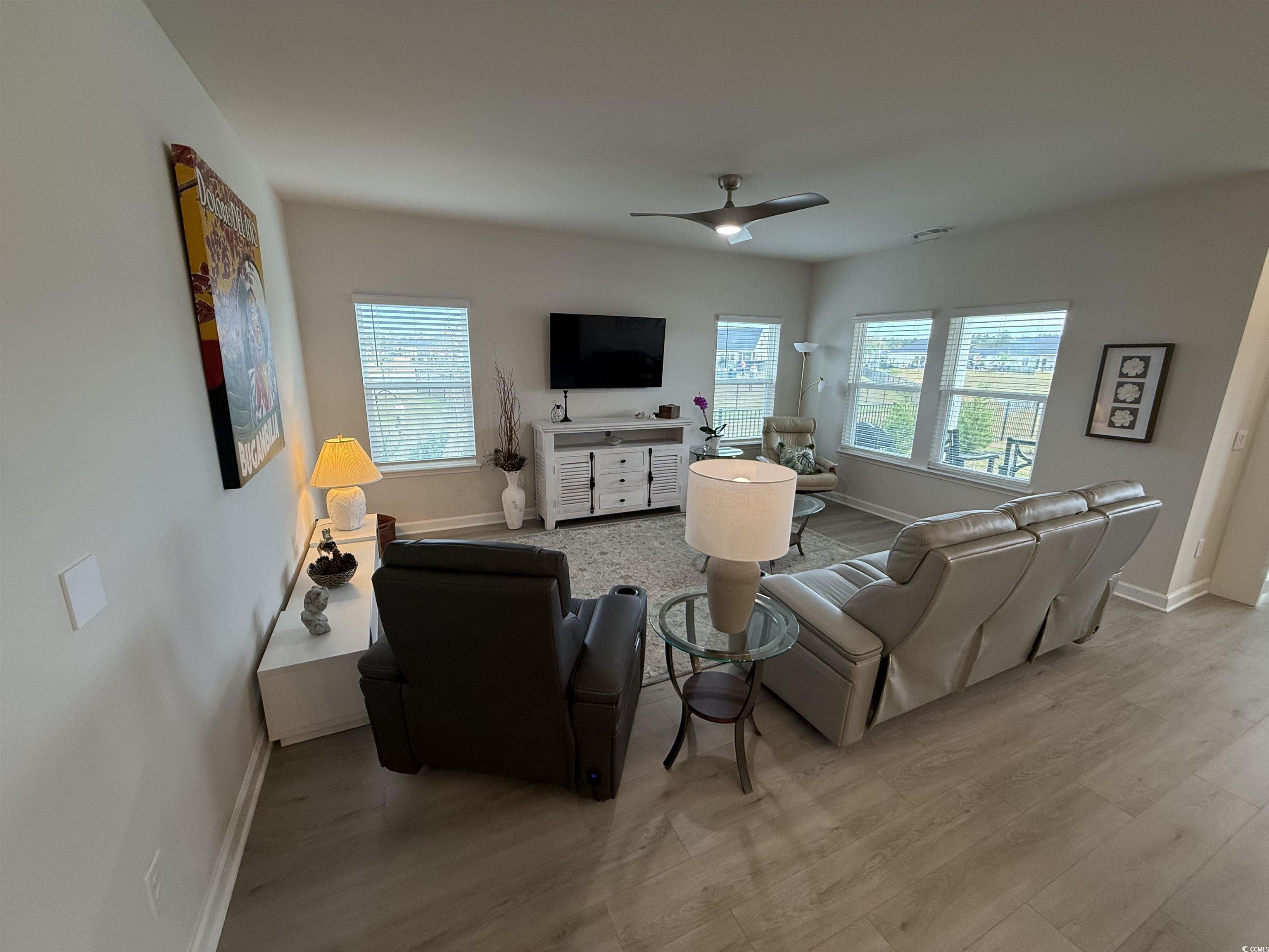 435 Rollins Drive Longs, SC 29568 - Photo 4 of 23 Living room with light wood-style floors and ceiling fan
