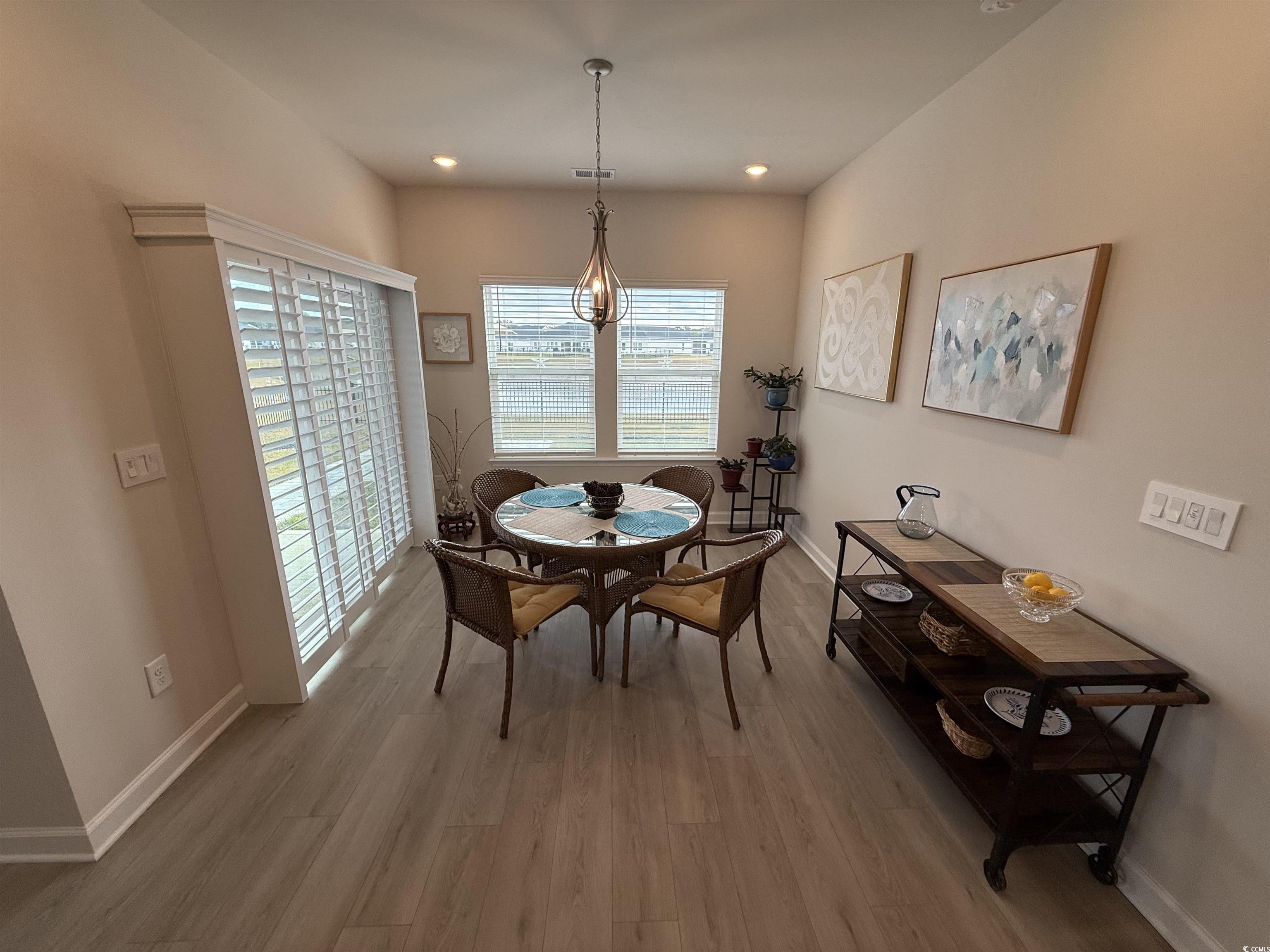 435 Rollins Drive Longs, SC 29568 - Photo 6 of 23 Dining room with light wood-style flooring and recessed lighting