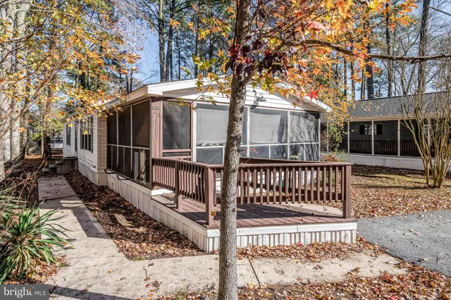 a view of a house with wooden fence
