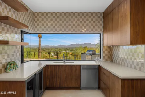 a view of a room with a sink and furniture