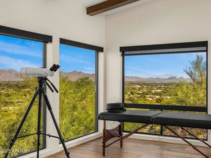 a view of a balcony with furniture