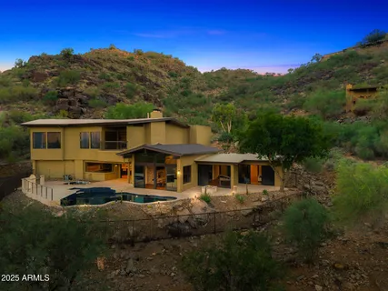 a view of a big house with a big yard