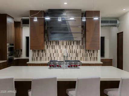 a kitchen with a refrigerator and countertop