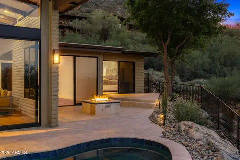 a view of a house with backyard and porch