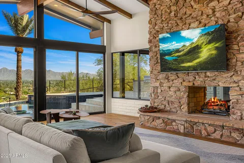 a living room with fireplace furniture and a flat screen tv