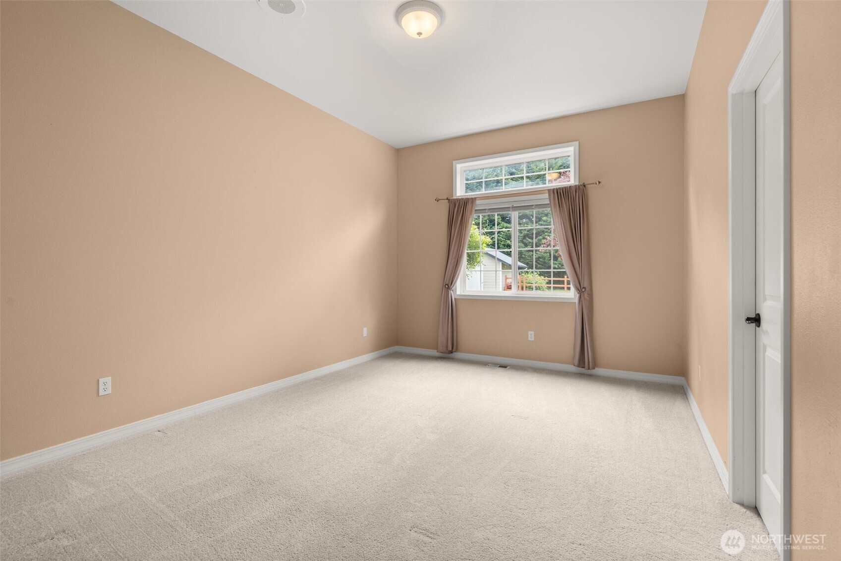 9609 346th Street South Roy, WA 98580 - Photo 22 of 37 a view of an empty room with a window
