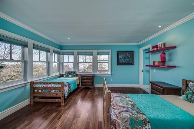 a bedroom with furniture and a window