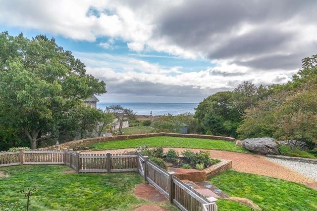 a view of a garden with furniture
