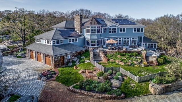 front view of a house with a garden
