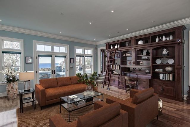 a living room with furniture and large window