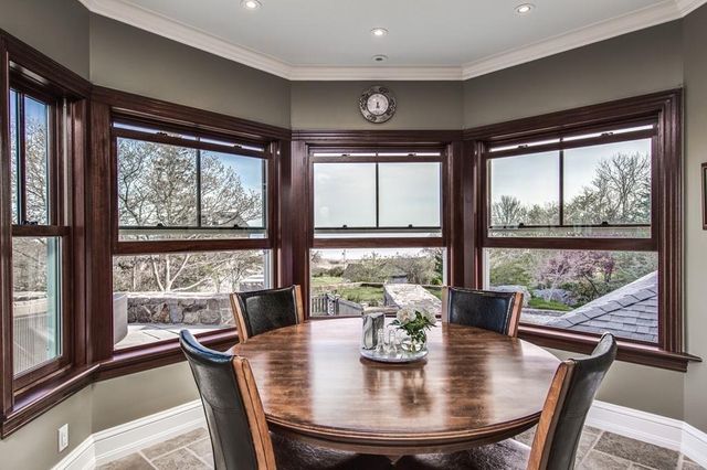 a view of a dining room with furniture and window