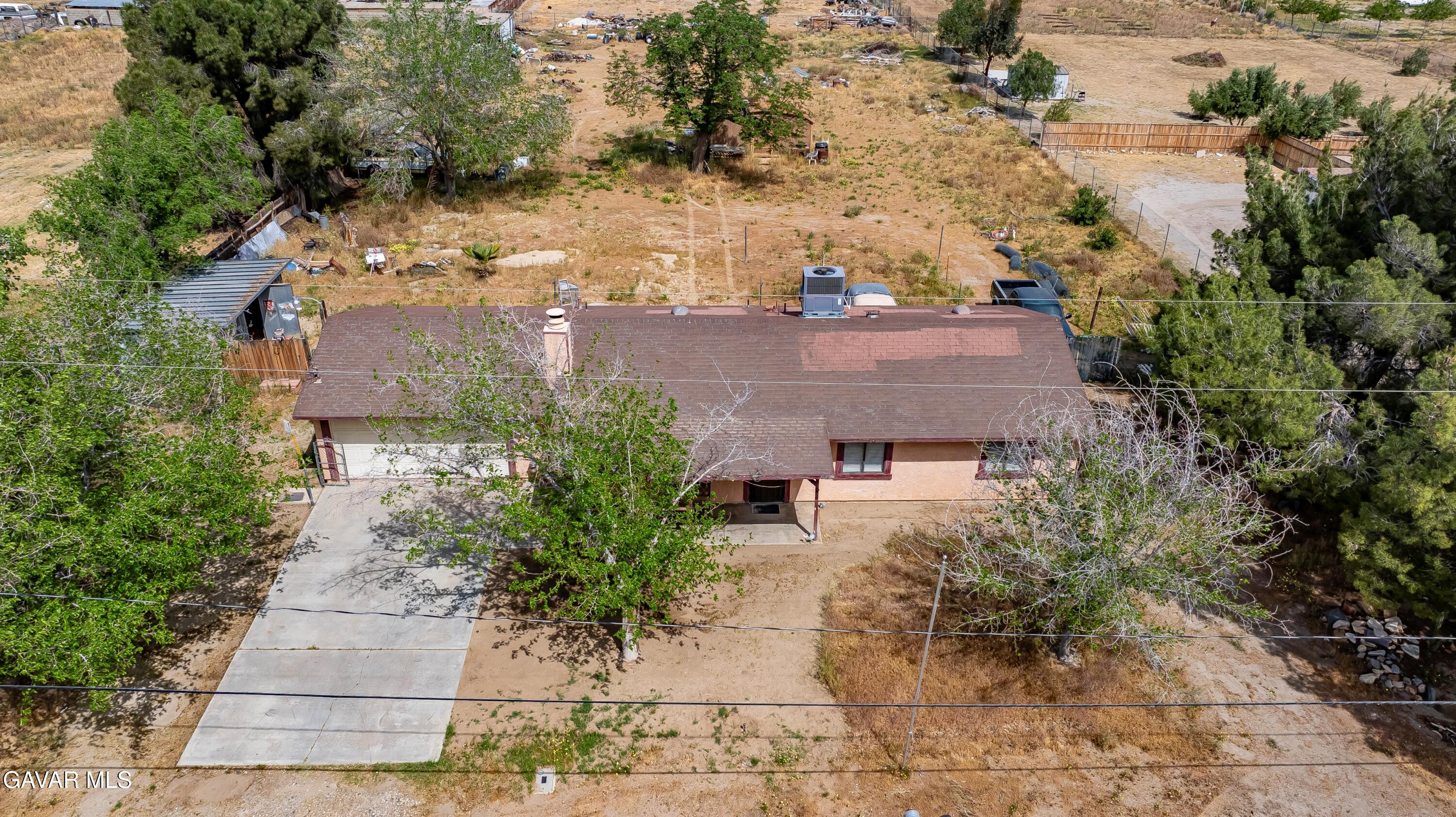 10731 East Ave R-2 Littlerock, CA 93543 - Photo 1 of 23 an aerial view of multiple houses with outdoor space