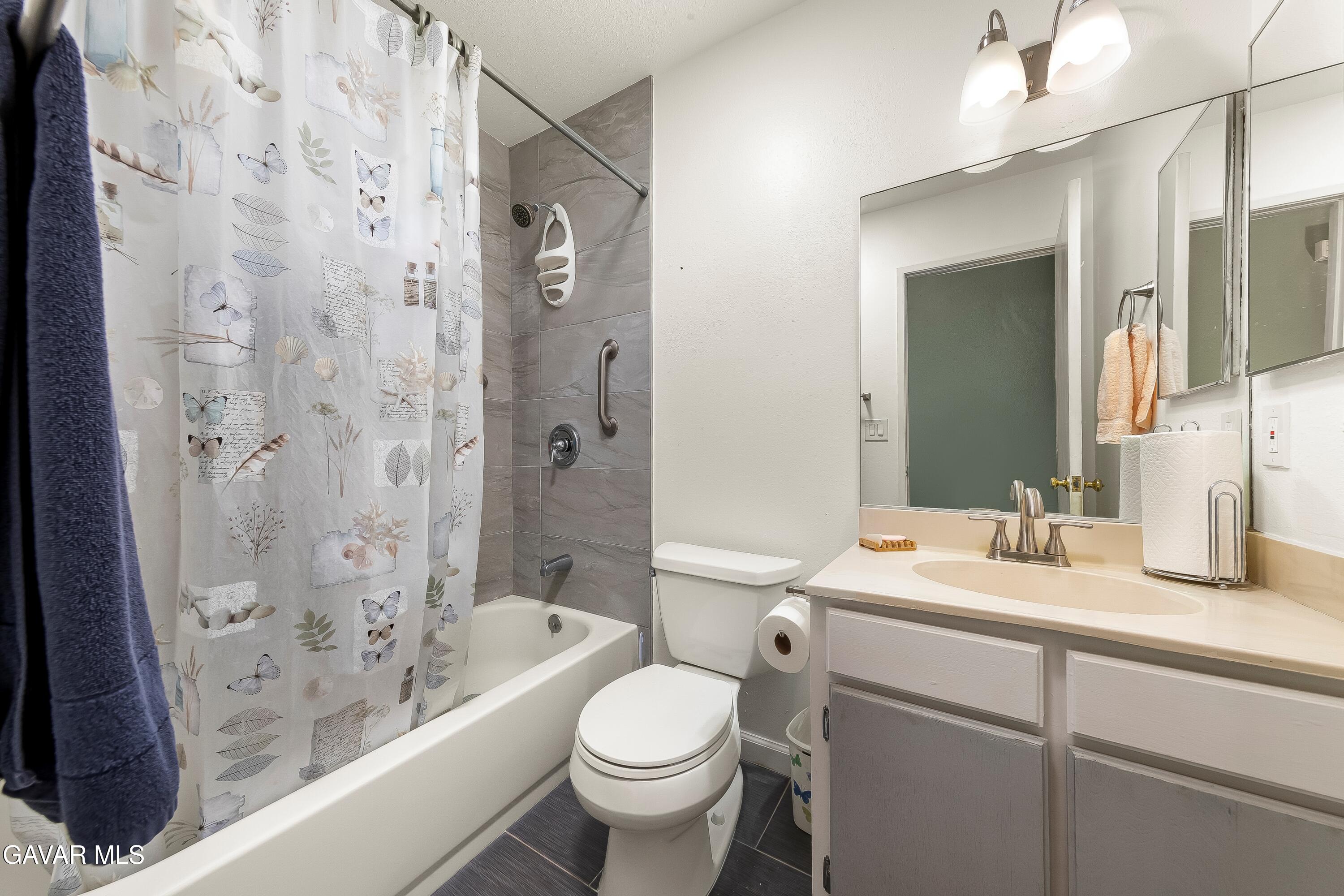 10731 East Ave R-2 Littlerock, CA 93543 - Photo 12 of 23 a bathroom with a sink toilet vanity granite shower and bathtub