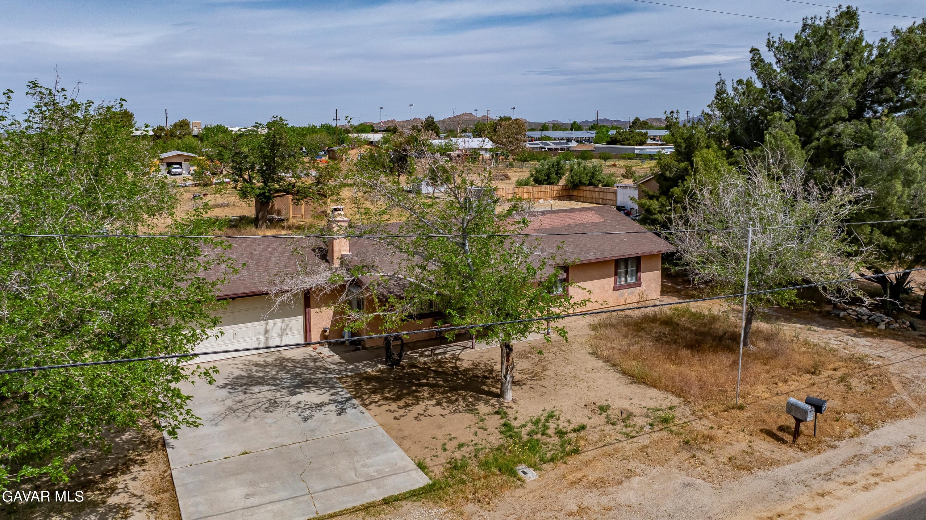 10731 East Ave R-2 Littlerock, CA 93543 - Photo 2 of 23 an aerial view of residential houses with outdoor space