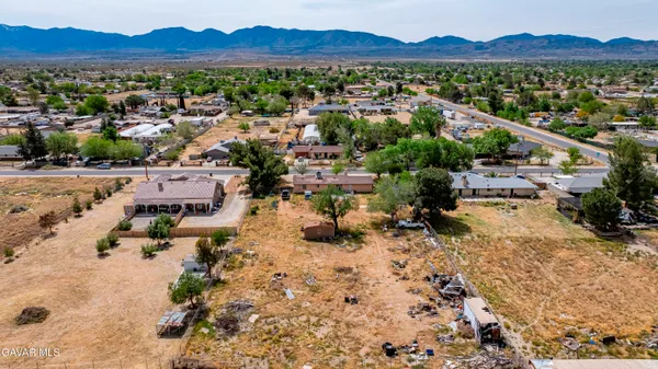 an aerial view of house with yard