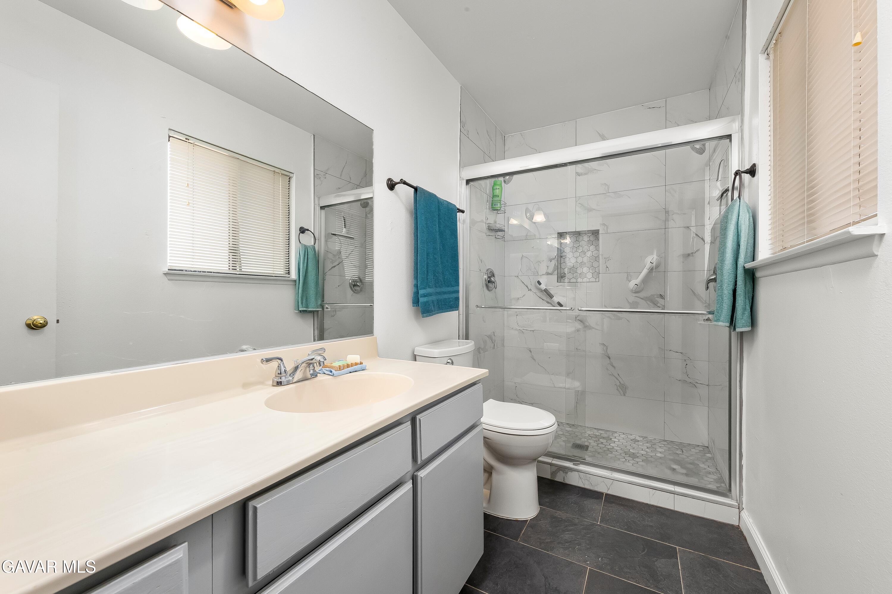 10731 East Ave R-2 Littlerock, CA 93543 - Photo 10 of 23 a bathroom with a sink a toilet and shower