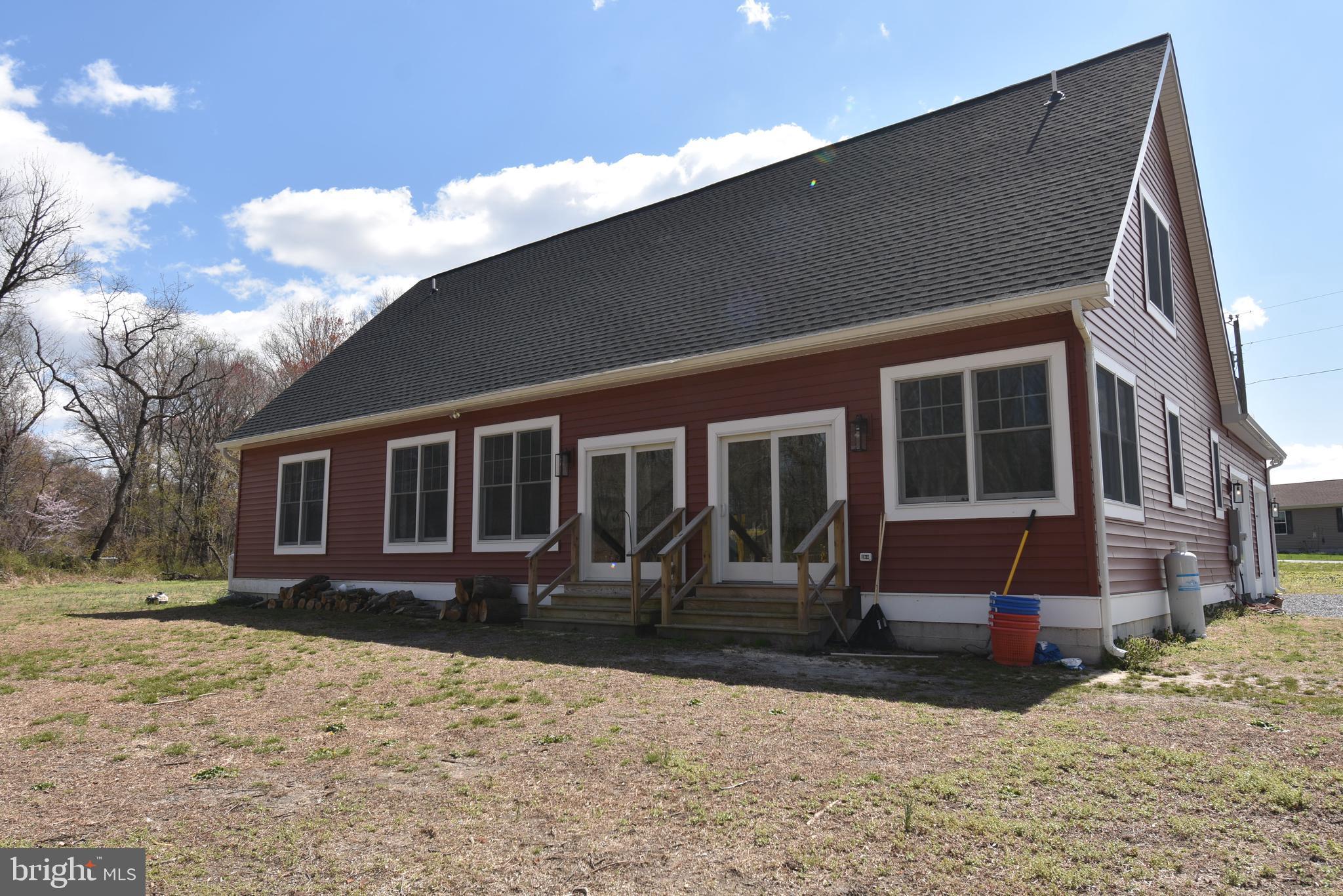 23730 Henry Road Ridgely, MD 21660 - Photo 3 of 28 a front view of a house with a yard