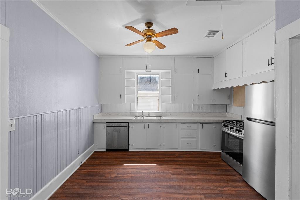 323 Butler Road Belcher, LA 71004 - Photo 13 of 28 a kitchen with granite countertop a sink cabinets stainless steel appliances and a window