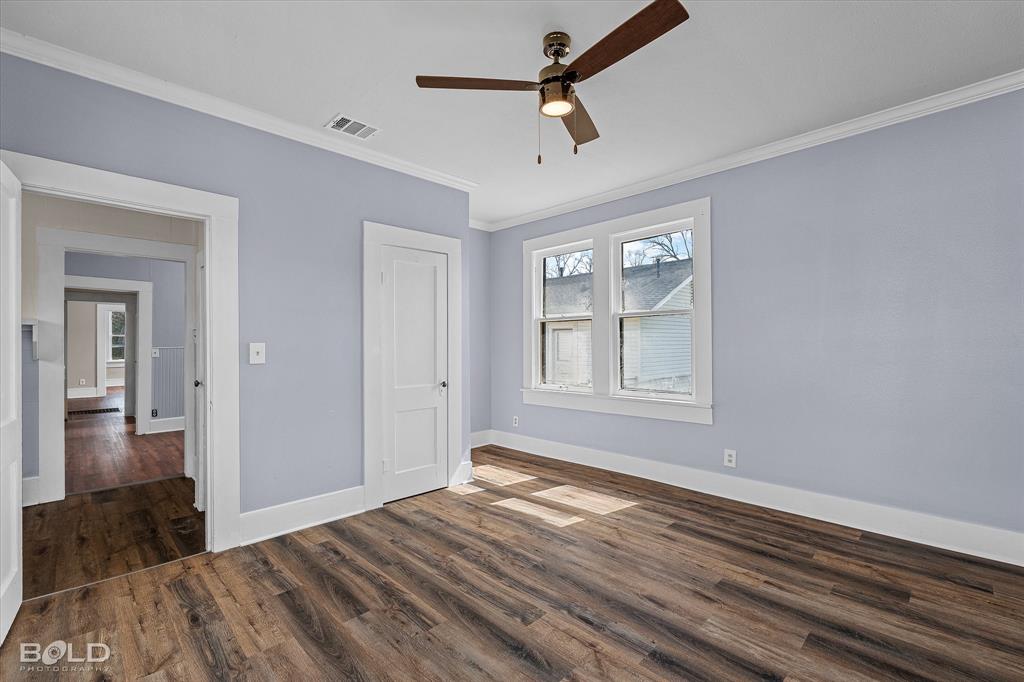 323 Butler Road Belcher, LA 71004 - Photo 19 of 28 a view of empty room with wooden floor and fan